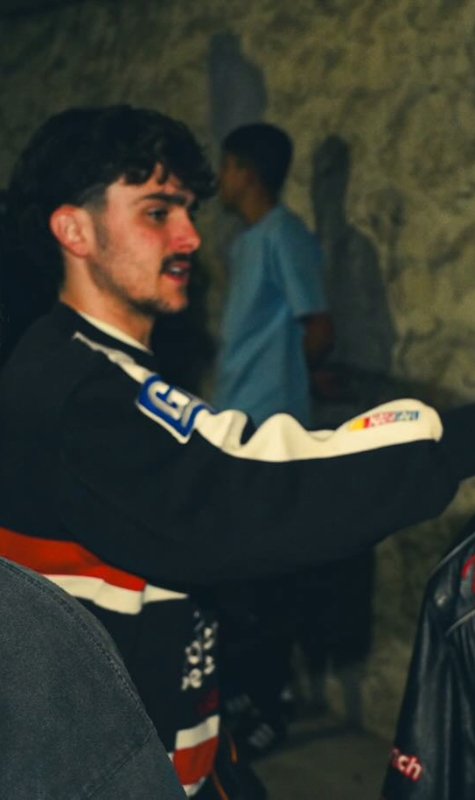 Krystian Black walking outside Underground Vintage